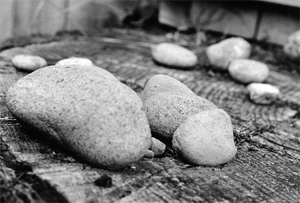 black and white three rocks and scattered stones